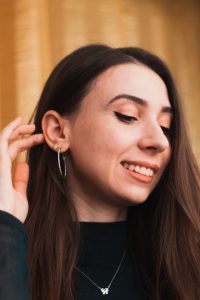 happy woman with earrings