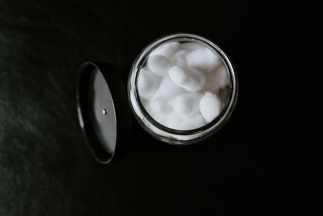 round container with cotton balls