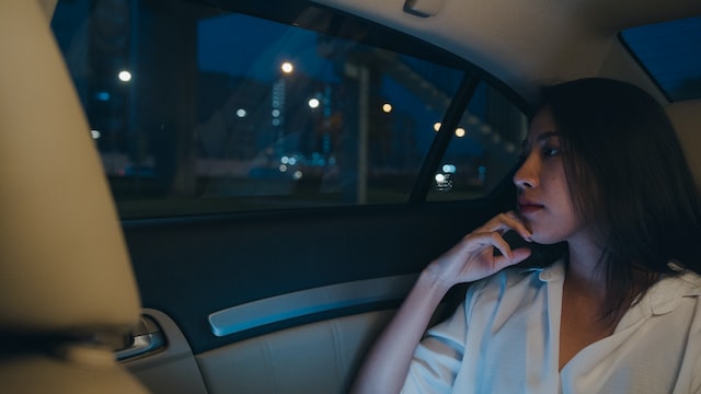 successful young asia businesswoman in car