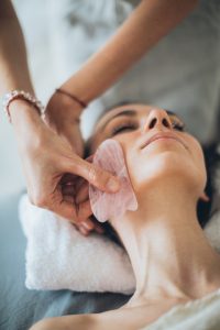 woman getting facial facial massage